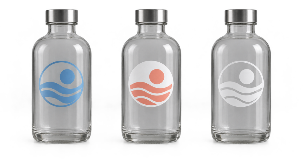 Three clear glass bottles comparing transparent color, a selective white underbase, and visible white ink on clear stickers.